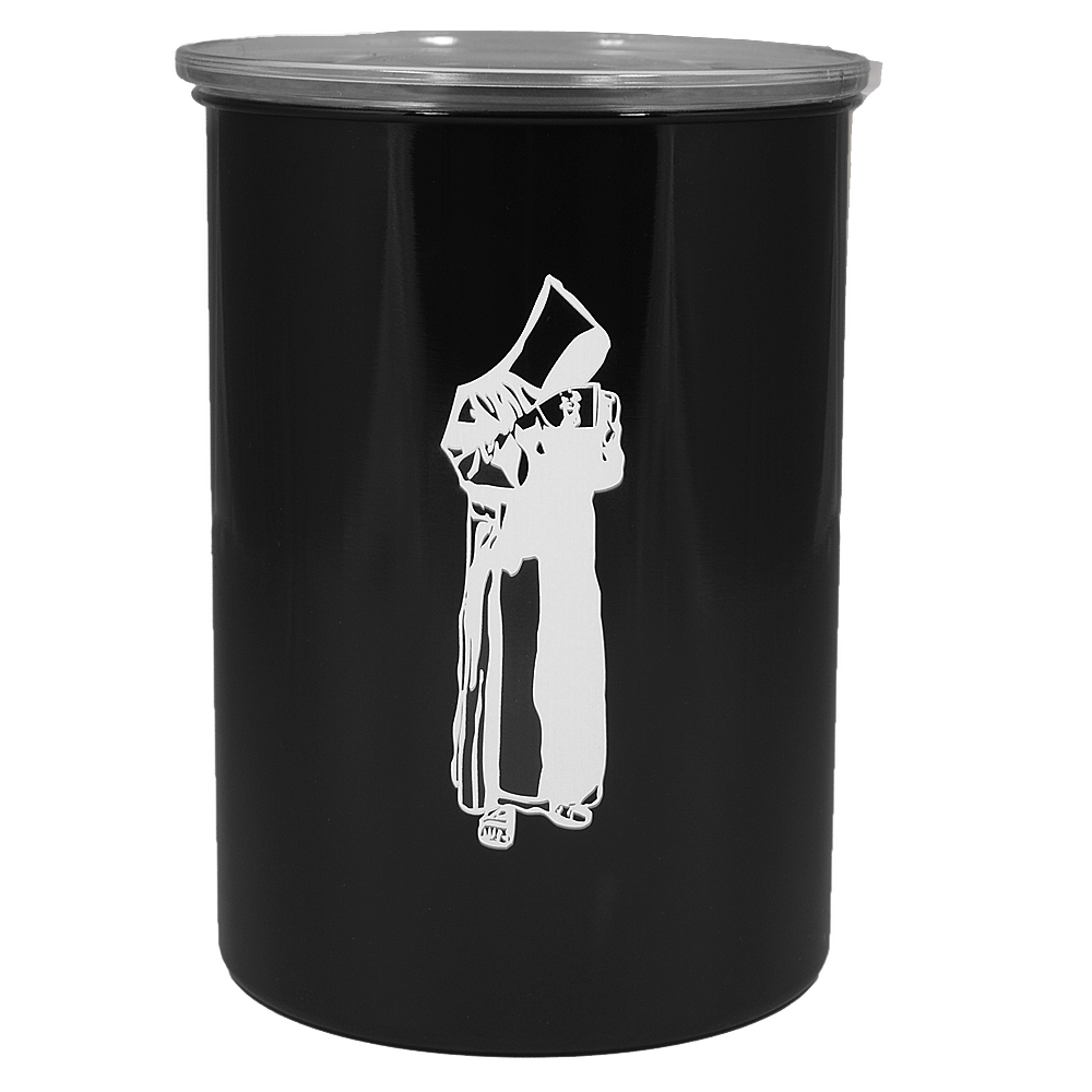 A black cylindrical container with a silver rim features a white silhouette of a person in a long robe, holding an object. The background is plain and unadorned.