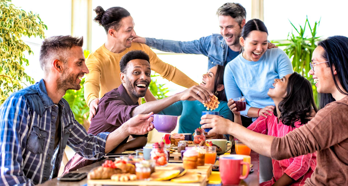 A Group of friends enjoying coffee and a breakfast bar together 