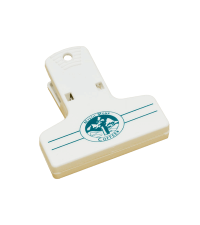 Mystic Monk Bag Clip in white plastic with teal logo